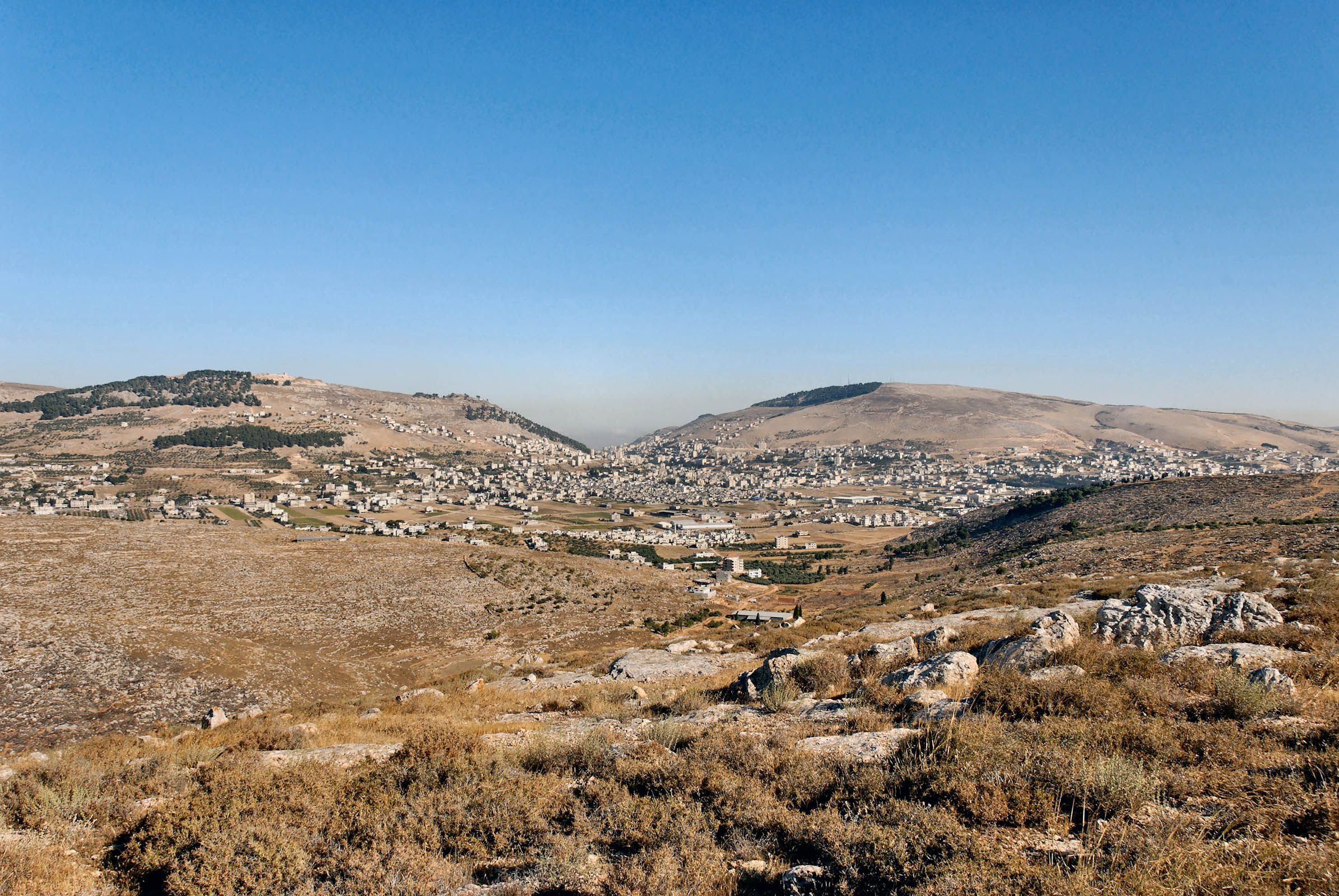 Mt Gerezim, Shechem, Mt. Ebal from east.  In Deuteronomy 11, Moses instructs that when Israel enters the land, she is to read the blessings from Mt. Gerezim and the curses from not following His word from Mt. Ebal. Today, Shechem is also known as the Arab city of Nablus. Courtesy of the [Pictorial Library of Bible Lands](https://www.bibleplaces.com)