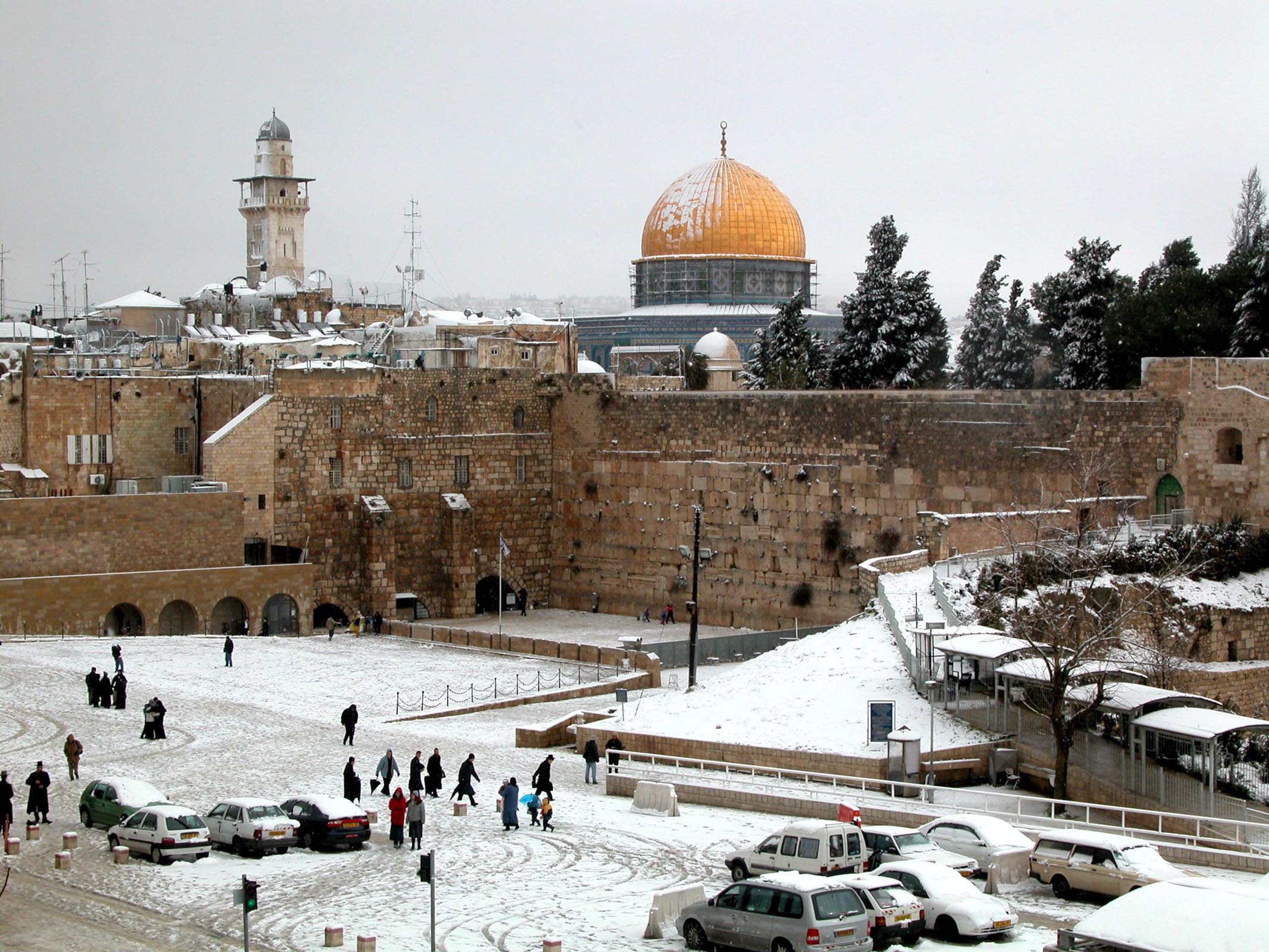 Western Wall plaza and Dome of the Rock with snow.  The Temple Mount,  specifically the rock enshrined by Islam's Dome of the Rock, is the traditional location of Abraham's near-sacrifice of Isaac described in Genesis 22.  Courtesy of the [Pictorial Library of Bible Lands](https://www.bibleplaces.com)